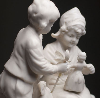 Figurine with Doll