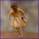 Early cotton Christmas ornament GIRL ON SWING