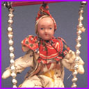 Antique Christmas ornament CLOWN on SWING