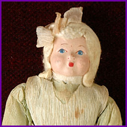 Antique Christmas ornament GIRL in Traditional Dress