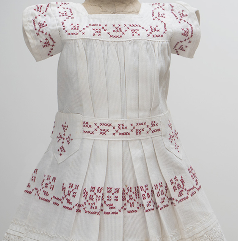 White Cambric Pinafore with res Cross-Stitch