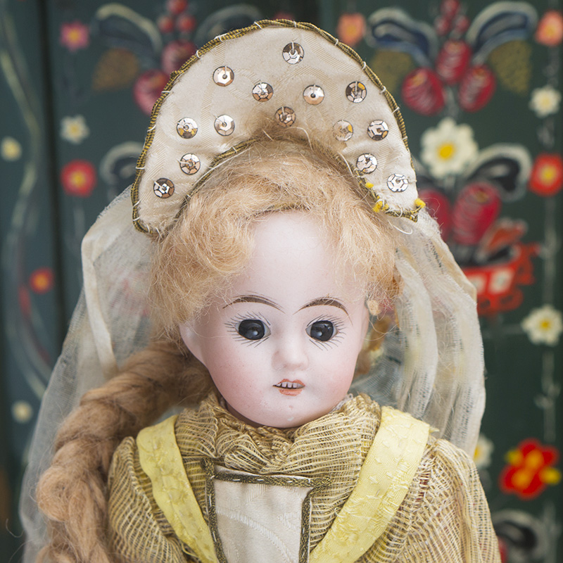 Antique doll in russian costume