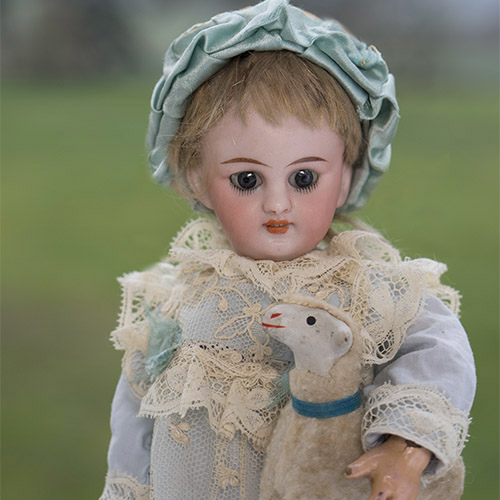 Tiny S&H doll with lamb