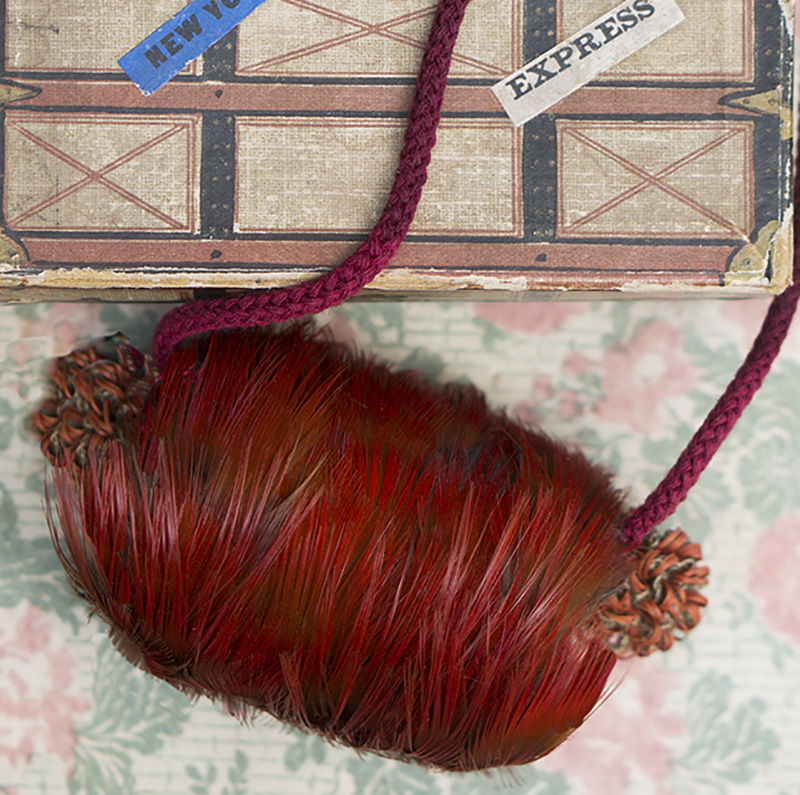 Red feather muff in box