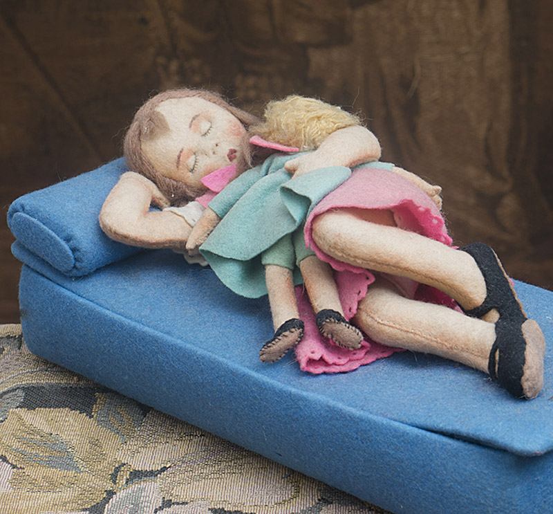 Unusual sleeping felt doll